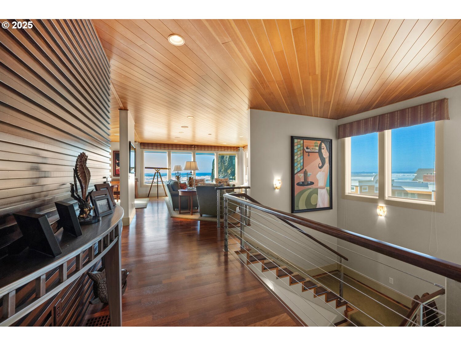 1880 Pacific Avenue Cannon Beach, OR 97110 - Photo 32 of 48 a living room with furniture a flat screen tv and a table