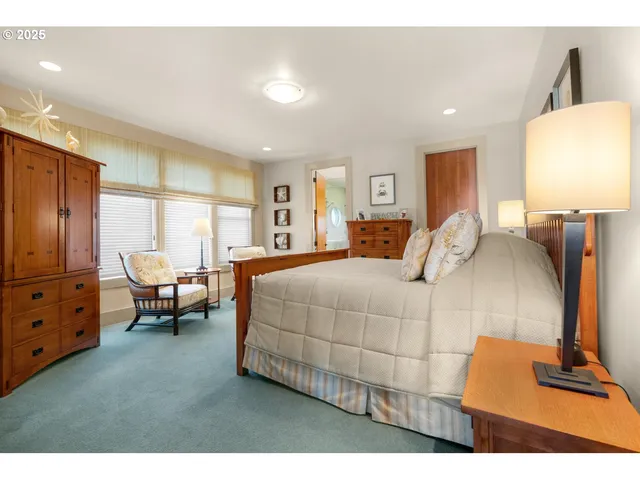 a bedroom with a bed and a view of bedroom