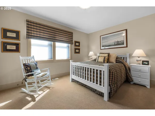 a bathroom with a toilet a sink a mirror and vanity