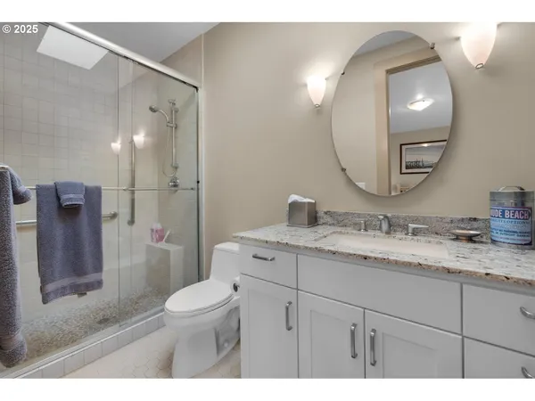 a bedroom with furniture and a large window