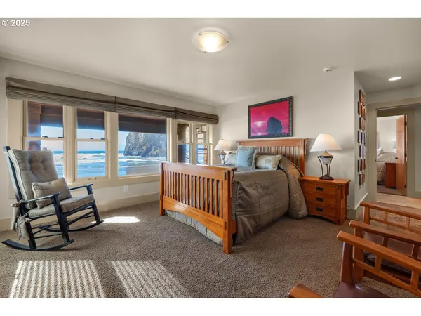 a bedroom with furniture and a window