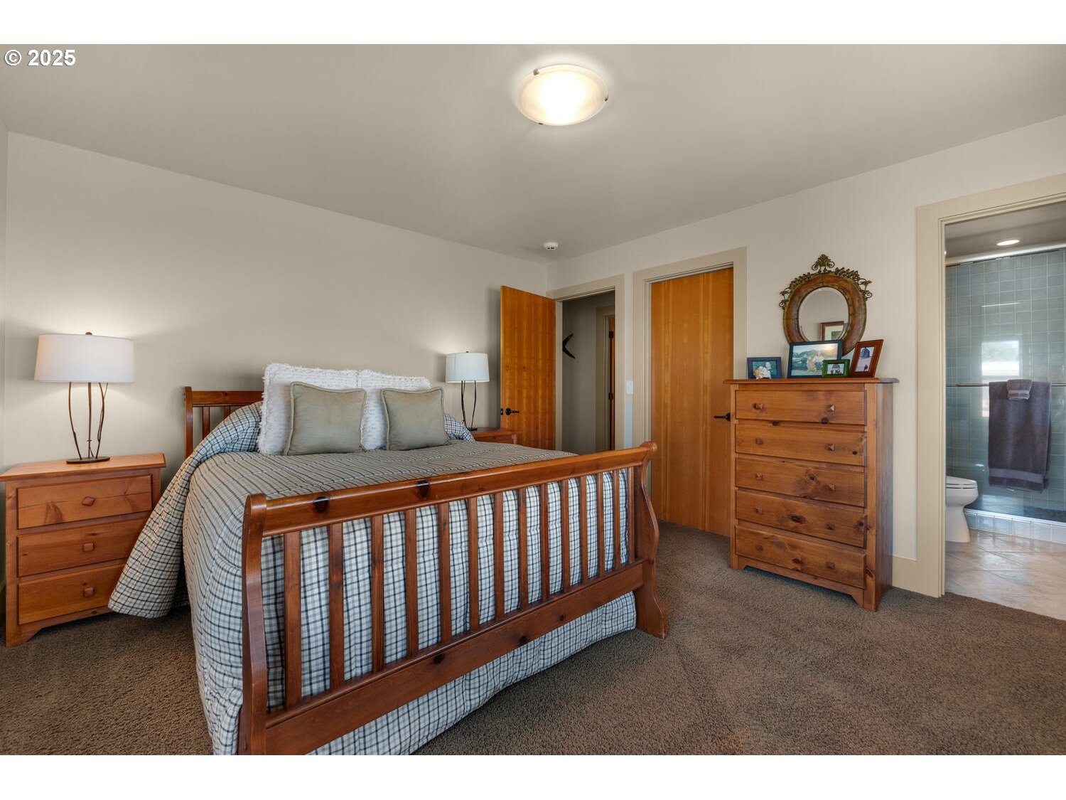 1880 Pacific Avenue Cannon Beach, OR 97110 - Photo 44 of 48 a bedroom with a bed and wooden floor