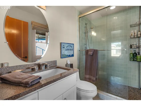 a bathroom with a toilet a sink and a mirror