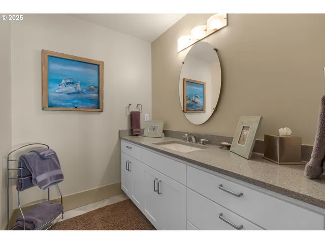 a living room with furniture a fireplace and a floor to ceiling window
