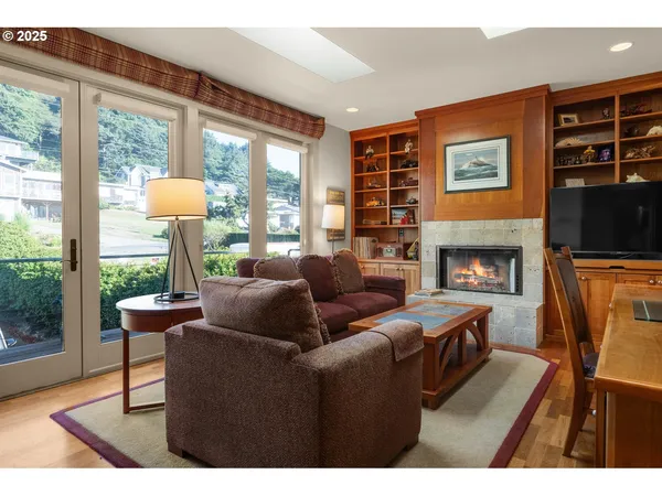 a living room with furniture a table and a large window