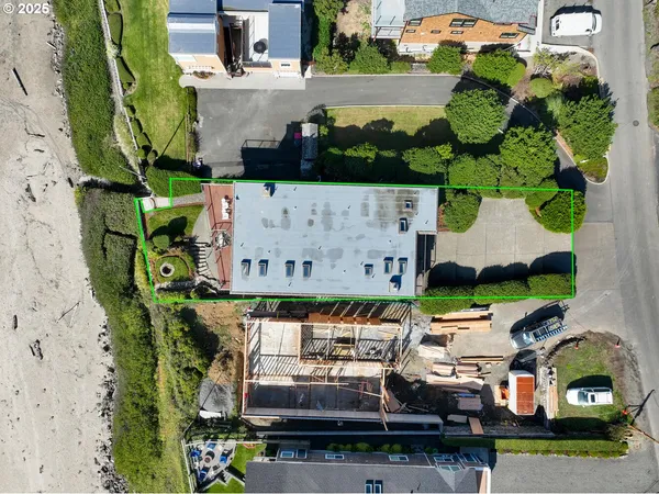 an aerial view of a house with a garden