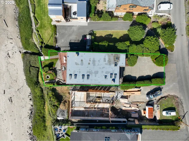 an aerial view of a house with a garden