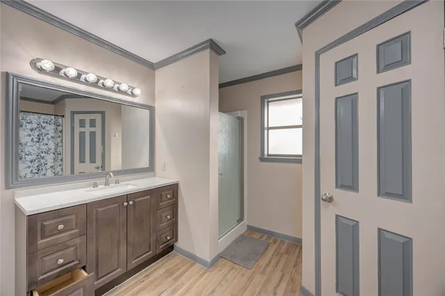 a spacious bathroom with a double vanity sink and a mirror