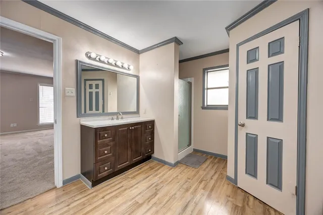 a bathroom with a sink vanity and mirror