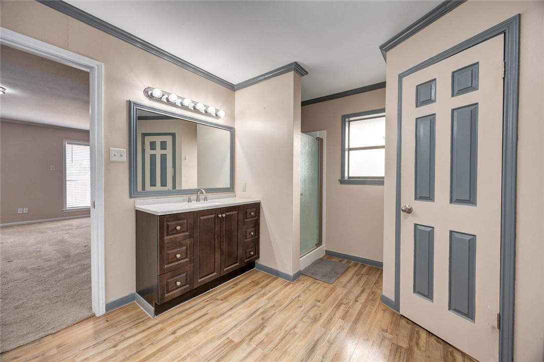 4737 Spring Fork Drive Corpus Christi, TX 78413 - Photo 20 of 37 a bathroom with a sink vanity and mirror
