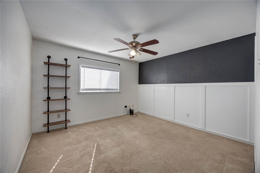 4737 Spring Fork Drive Corpus Christi, TX 78413 - Photo 28 of 37 an empty room with windows and ceiling fan