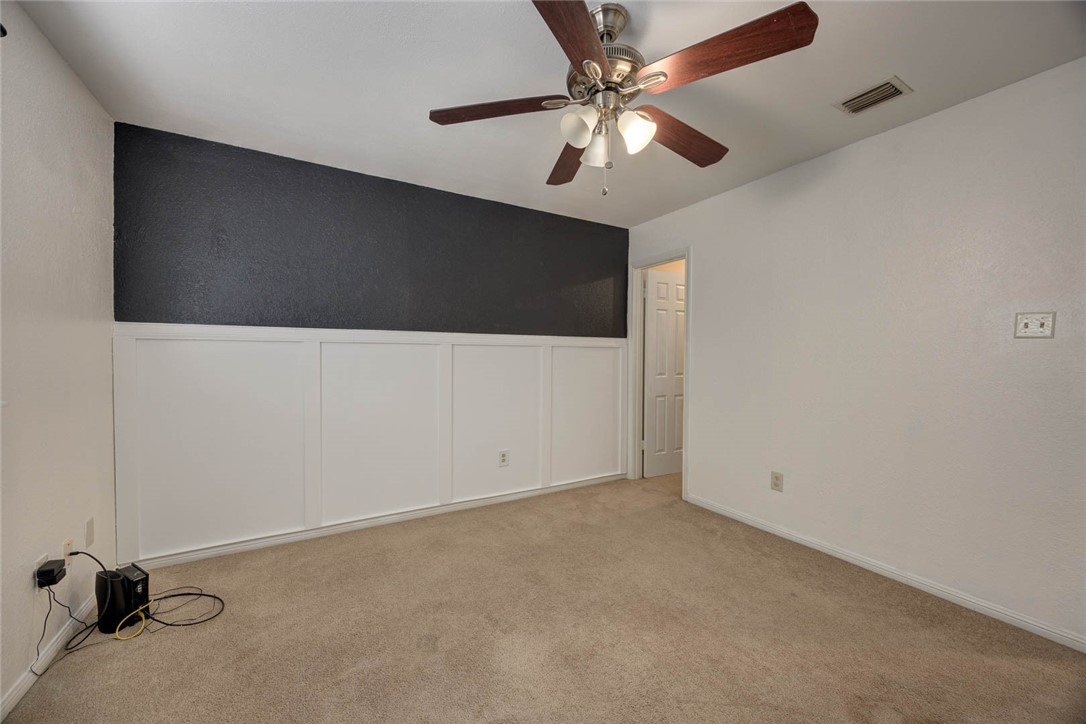 4737 Spring Fork Drive Corpus Christi, TX 78413 - Photo 29 of 37 an empty room with a ceiling fan and a window