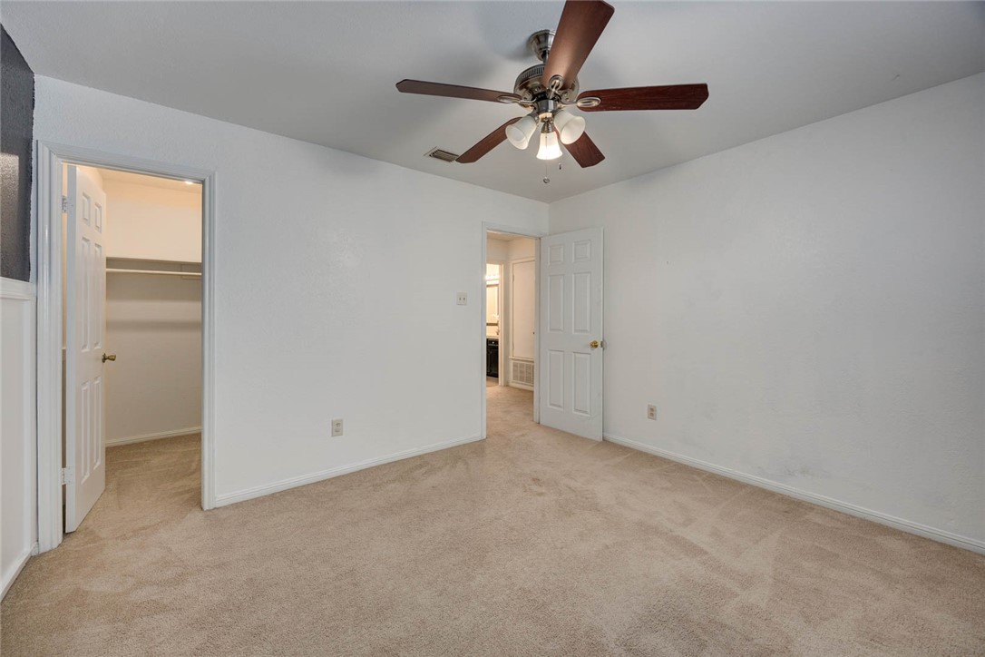 4737 Spring Fork Drive Corpus Christi, TX 78413 - Photo 30 of 37 an empty room with chandelier fan