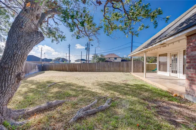 a view of a backyard of the house