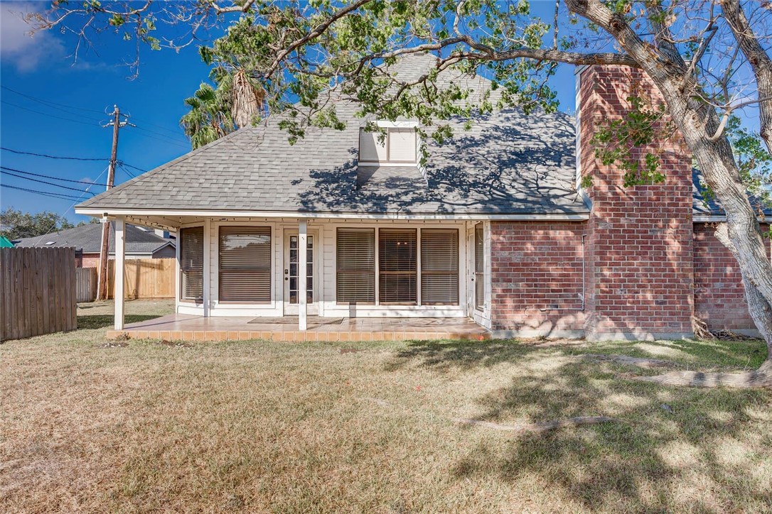 4737 Spring Fork Drive Corpus Christi, TX 78413 - Photo 34 of 37 a front view of a house with a garden