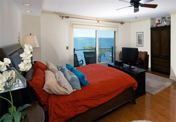 11 Bradlee Road Marblehead, MA 01945 - Photo 12 of 19 a bed sitting in a bedroom next to a window