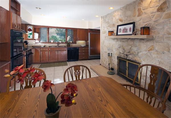 11 Bradlee Road Marblehead, MA 01945 - Photo 4 of 19 a kitchen with stainless steel appliances granite countertop a refrigerator a stove top oven a sink and dishwasher