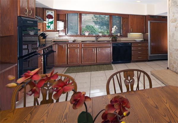 11 Bradlee Road Marblehead, MA 01945 - Photo 5 of 19 a kitchen with stainless steel appliances granite countertop a stove top oven a sink and dishwasher