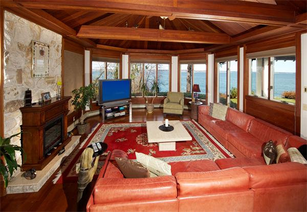 11 Bradlee Road Marblehead, MA 01945 - Photo 8 of 19 a living room with furniture fireplace and large windows