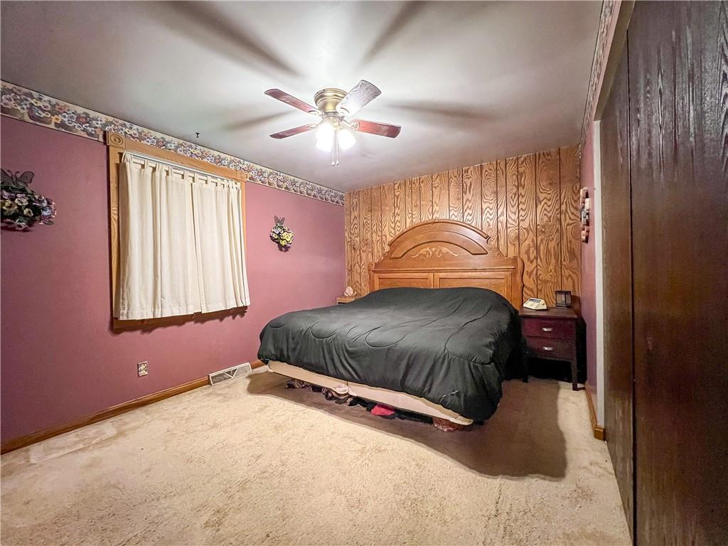 178 Hoon Road Butler, PA 16001 - Photo 12 of 26 a bedroom with a bed and a chandelier