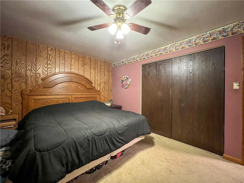 178 Hoon Road Butler, PA 16001 - Photo 13 of 26 a bedroom with a bed and a chandelier