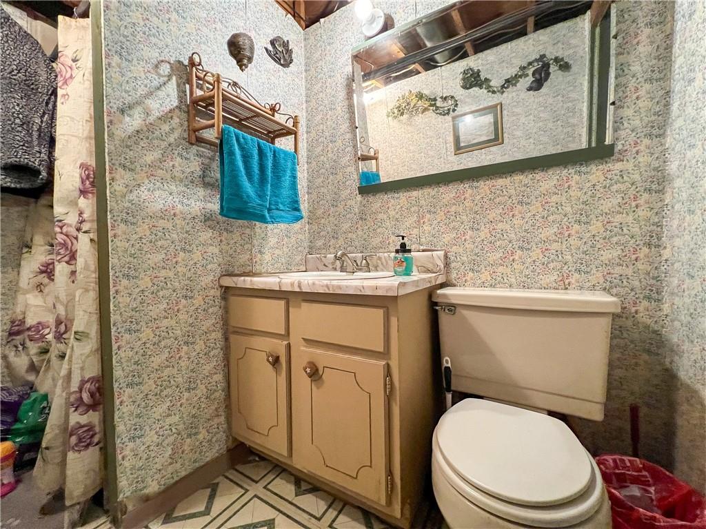178 Hoon Road Butler, PA 16001 - Photo 18 of 26 a bathroom with a toilet sink and mirror