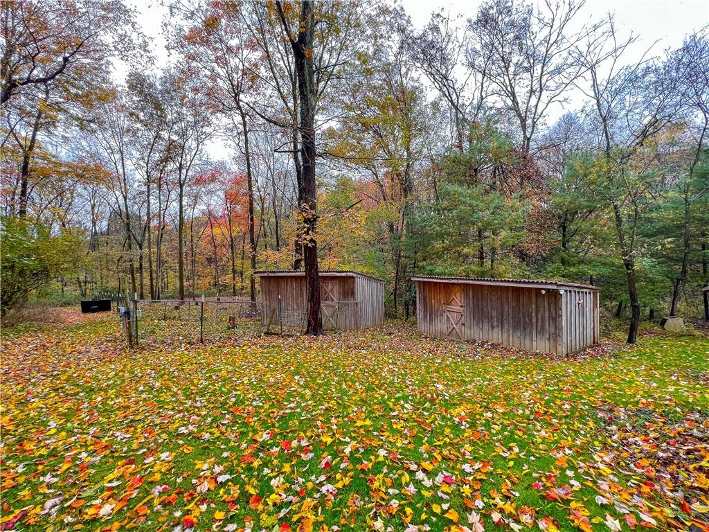 178 Hoon Road Butler, PA 16001 - Photo 19 of 26 a view of a backyard with large tree and wooden fence
