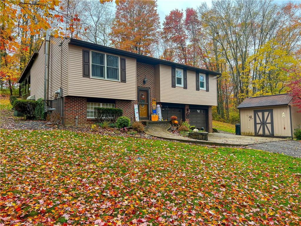 178 Hoon Road Butler, PA 16001 - Photo 24 of 26 a view of a house with a small yard and a large tree