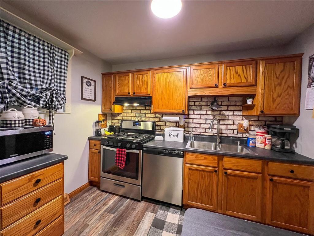 178 Hoon Road Butler, PA 16001 - Photo 4 of 26 a kitchen with stainless steel appliances granite countertop a stove and a refrigerator