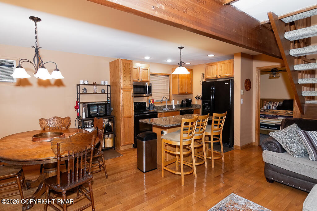 122 Dover Drive Bushkill, PA 18324 - Photo 11 of 45 a dining room with furniture and wooden floor