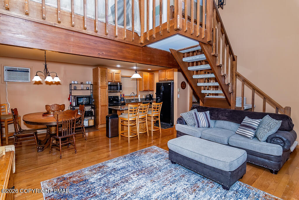 122 Dover Drive Bushkill, PA 18324 - Photo 12 of 45 a living room with furniture a ceiling fan and a rug