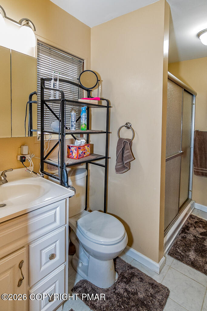 122 Dover Drive Bushkill, PA 18324 - Photo 23 of 45 a bathroom with a toilet sink and mirror