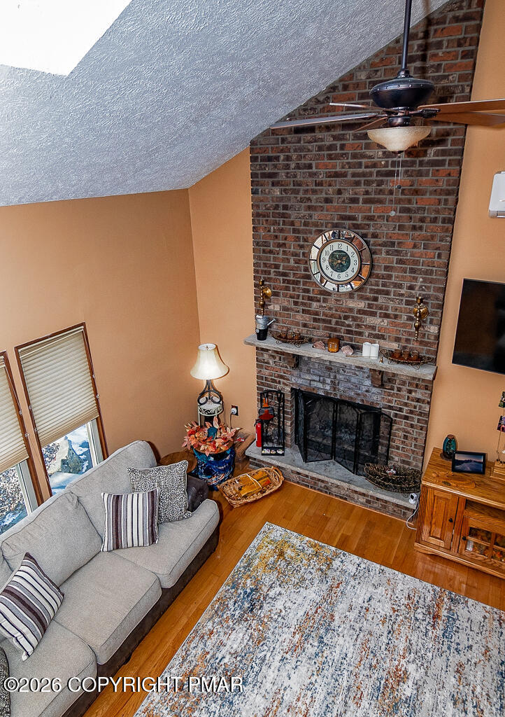 122 Dover Drive Bushkill, PA 18324 - Photo 27 of 45 a living room with furniture and a fireplace