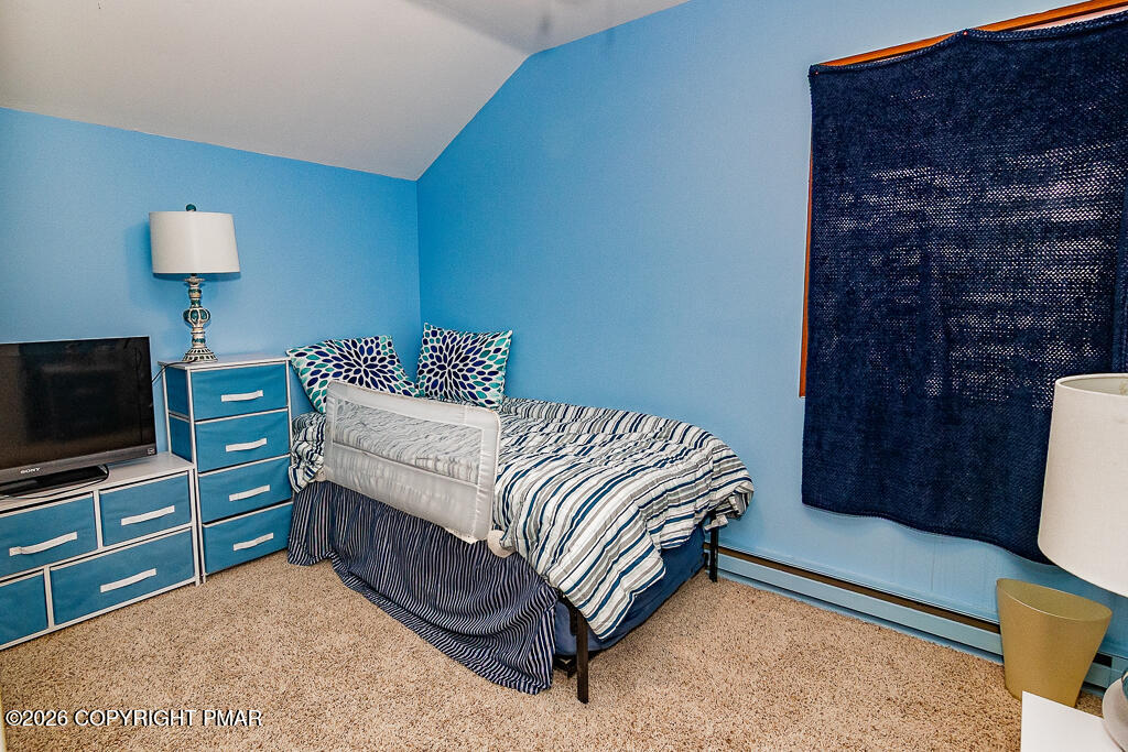 122 Dover Drive Bushkill, PA 18324 - Photo 35 of 45 a bedroom with a bed and a television