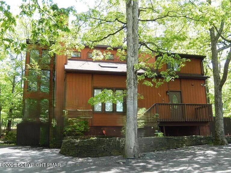 122 Dover Drive Bushkill, PA 18324 - Photo 45 of 49 a view of a house with a tree in front