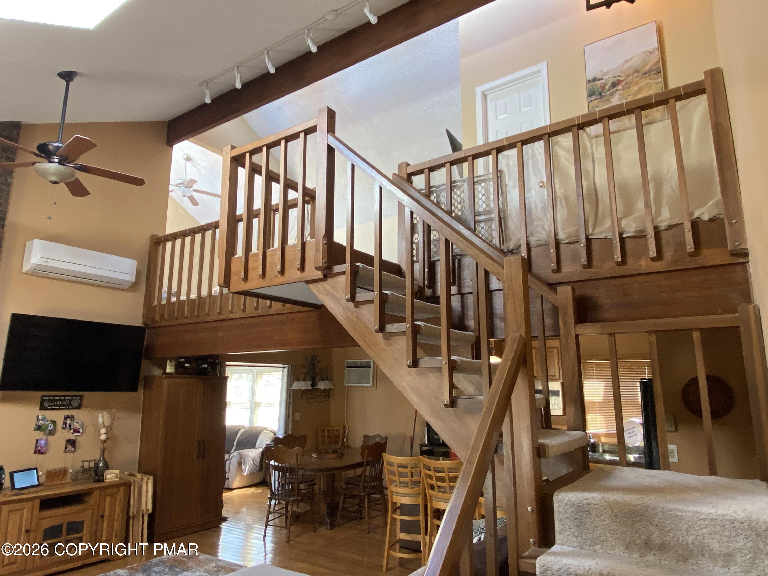 122 Dover Drive Bushkill, PA 18324 - Photo 46 of 49 a view of entryway livingroom and hall with wooden floor