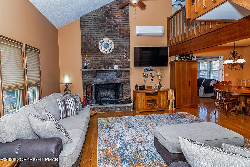 122 Dover Drive Bushkill, PA 18324 - Photo 6 of 45 a living room with furniture and a fireplace