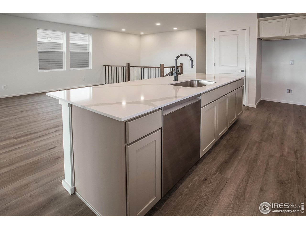 6071 Red Barn Road Timnath, CO 80547 - Photo 15 of 40 KITCHEN ISLAND AND DINING ROOM