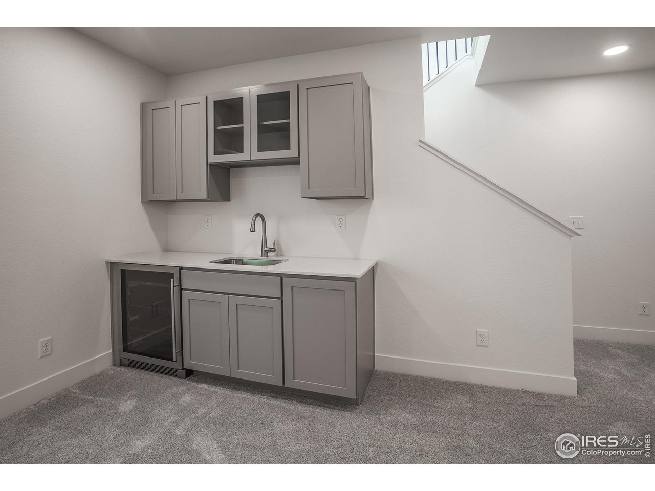 6071 Red Barn Road Timnath, CO 80547 - Photo 29 of 40 FINISHED BASEMENT WET BAR