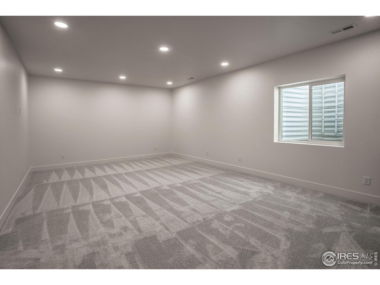 6071 Red Barn Road Timnath, CO 80547 - Photo 30 of 40 FINISHED BASEMENT REC ROOM