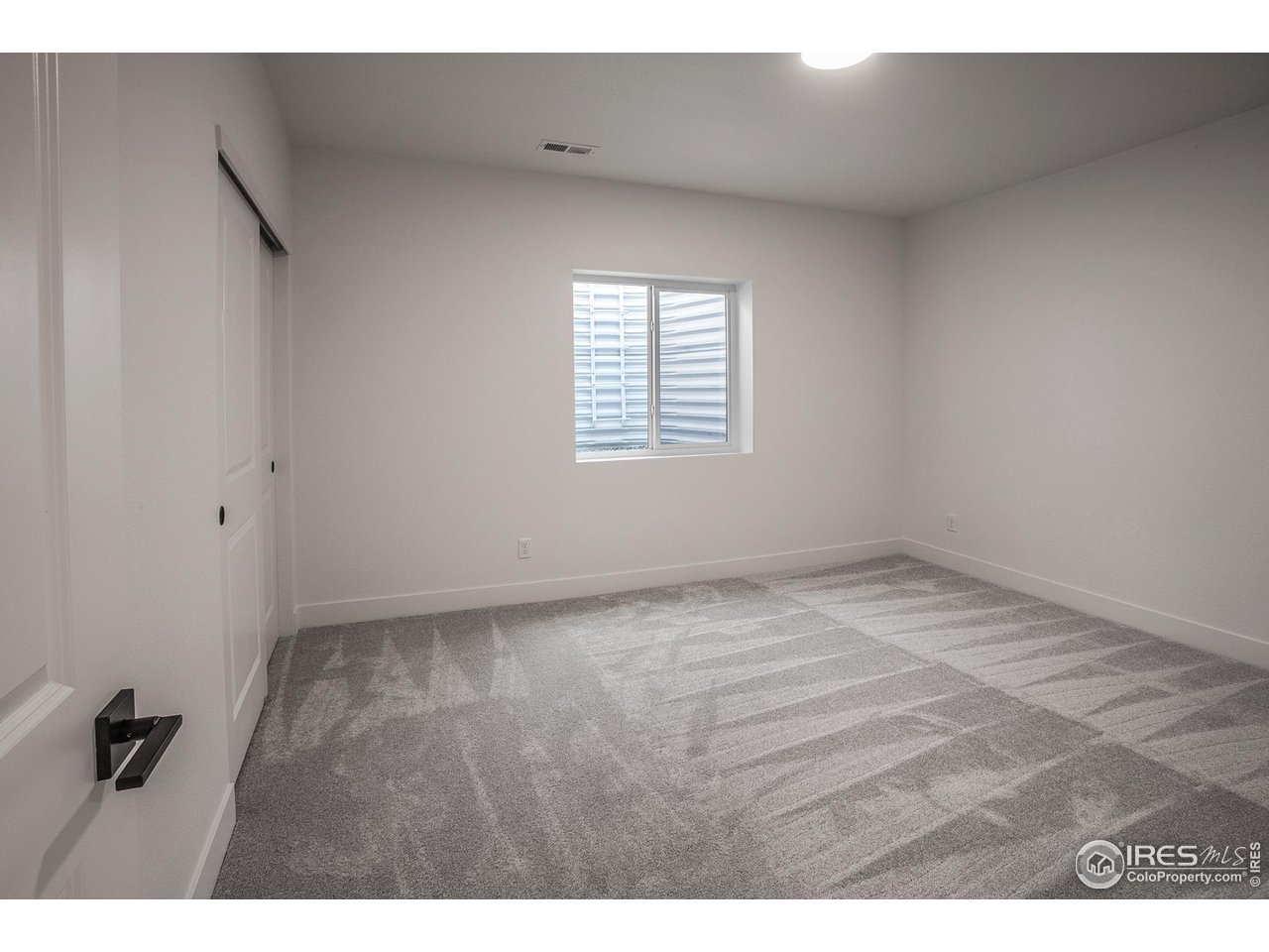 6071 Red Barn Road Timnath, CO 80547 - Photo 32 of 40 FINISHED BASEMENT BEDROOM