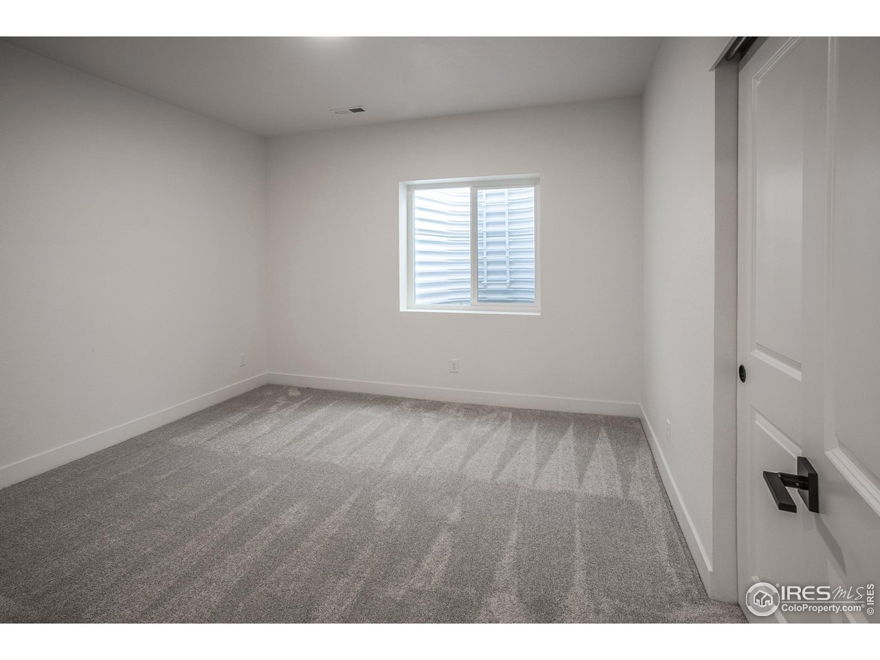 6071 Red Barn Road Timnath, CO 80547 - Photo 33 of 40 FINISHED BASEMENT BEDROOM