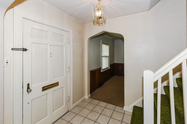 333 South Wolf Road Des Plaines, IL 60016 - Photo 2 of 25 a view of a hallway with wooden floor and staircase