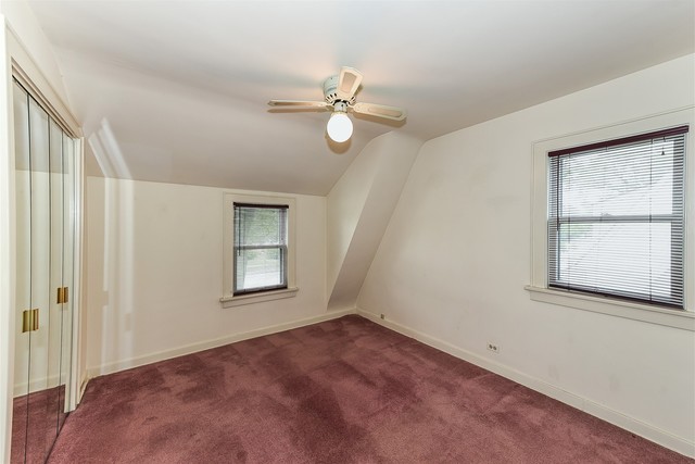 333 South Wolf Road Des Plaines, IL 60016 - Photo 21 of 25 an empty room with windows and fan