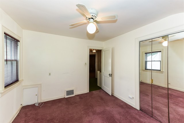 333 South Wolf Road Des Plaines, IL 60016 - Photo 22 of 25 a view of an empty room with window and wooden floor