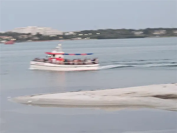 a view of a swimming pool and chairs