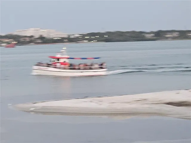 a view of a swimming pool and chairs