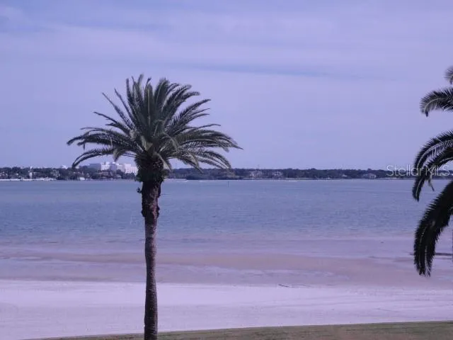 a view of a lake with sitting area