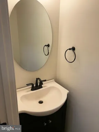 a bathroom with a sink and mirror