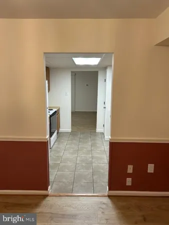 a kitchen with cabinets and stainless steel appliances